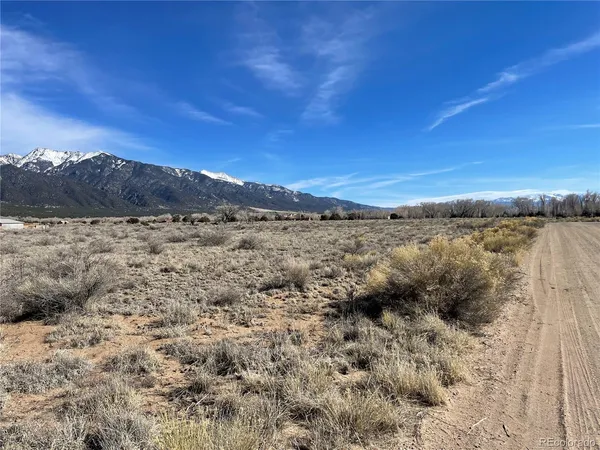 a view of a dry yard with mountain