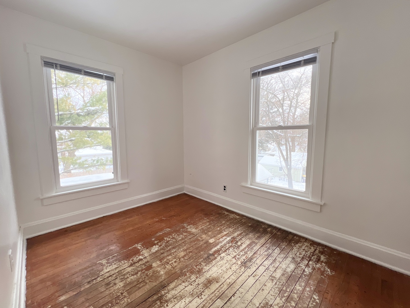 721 Dean Street, Unit 2 Woodstock, IL 60098 - Photo 12 of 17 an empty room with a window