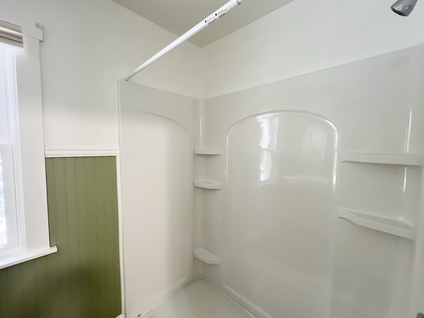 721 Dean Street, Unit 2 Woodstock, IL 60098 - Photo 13 of 17 a bathroom with a glass shower door