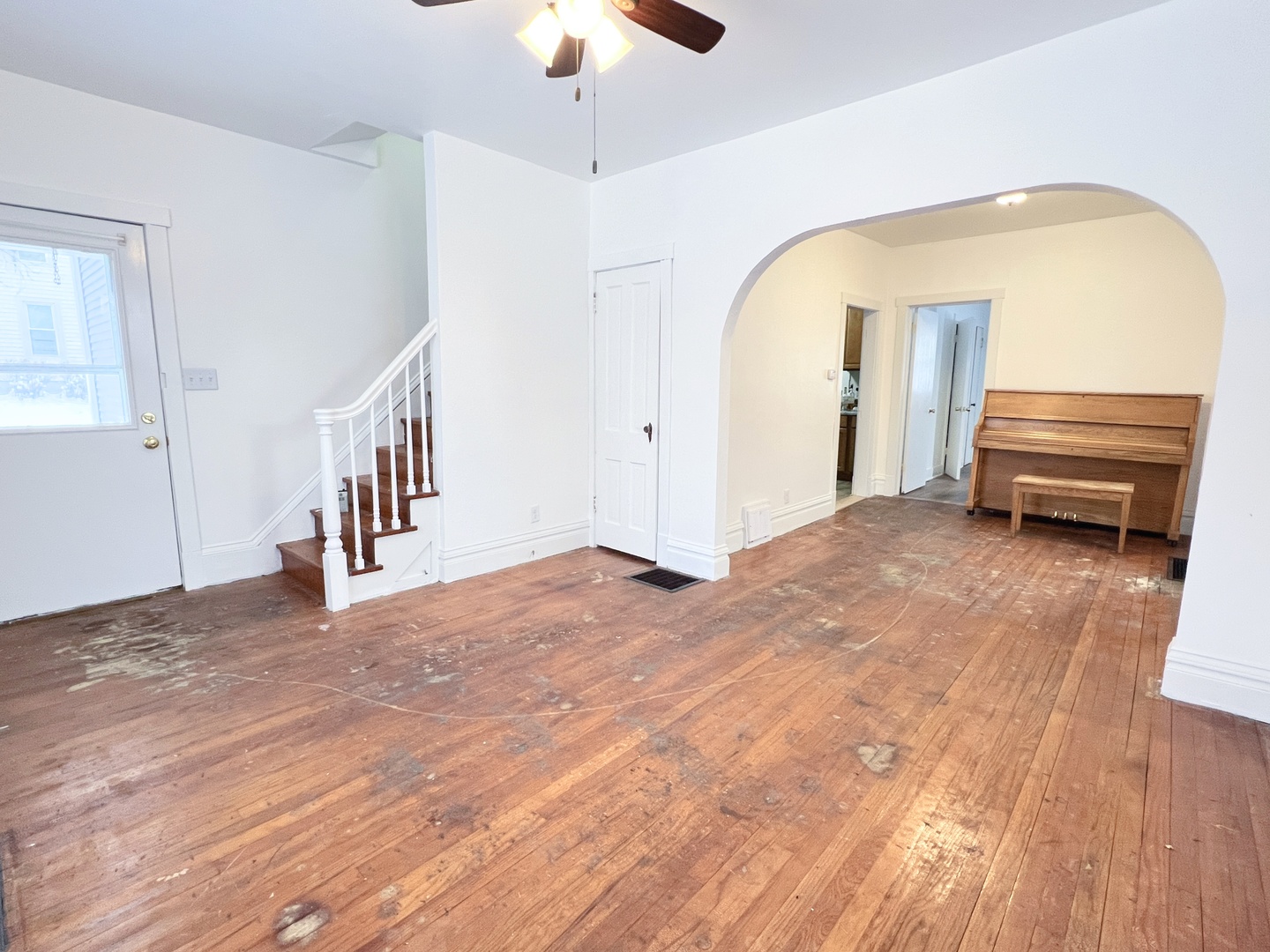721 Dean Street, Unit 2 Woodstock, IL 60098 - Photo 3 of 17 a view of livingroom with furniture and staircase