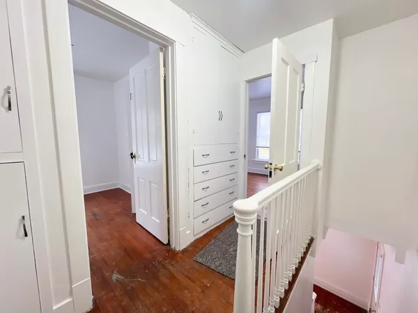 a view of a hallway with closet