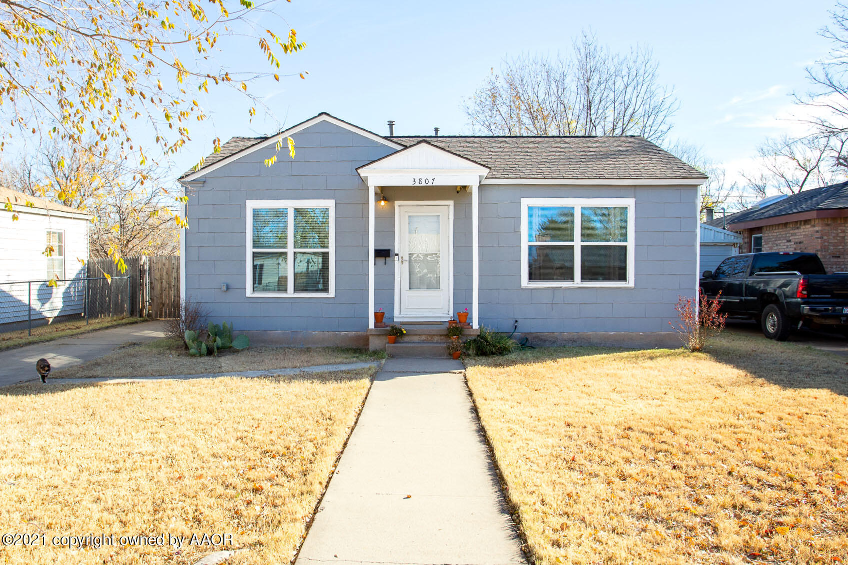 3807 South Jackson Street Amarillo, TX 79110 - Photo 1 of 17 a front view of a house with a yard