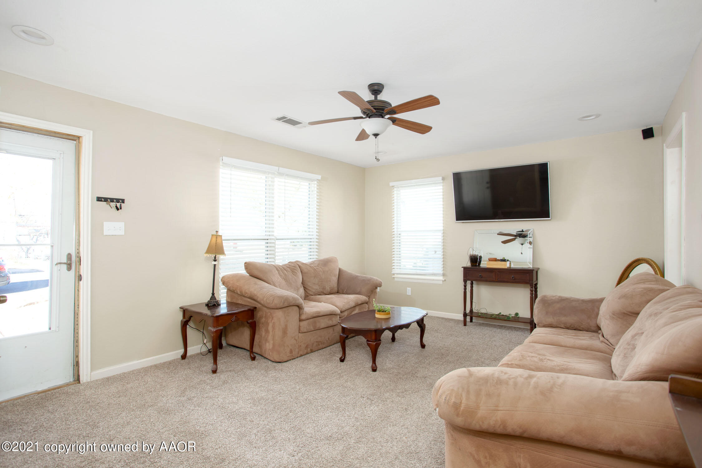 3807 South Jackson Street Amarillo, TX 79110 - Photo 3 of 17 a living room with furniture and a flat screen tv