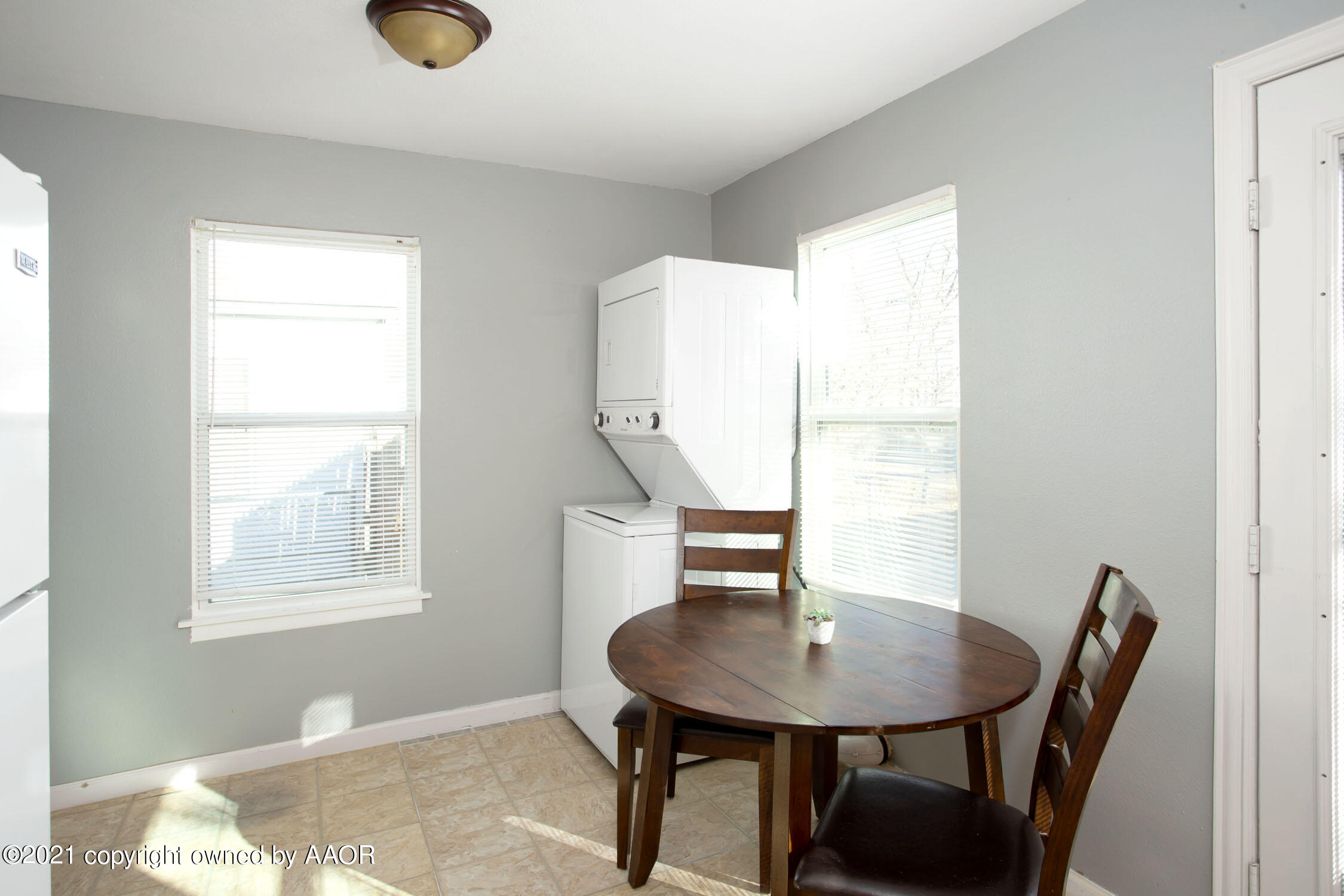 3807 South Jackson Street Amarillo, TX 79110 - Photo 8 of 17 a view of a dining room with furniture and a window