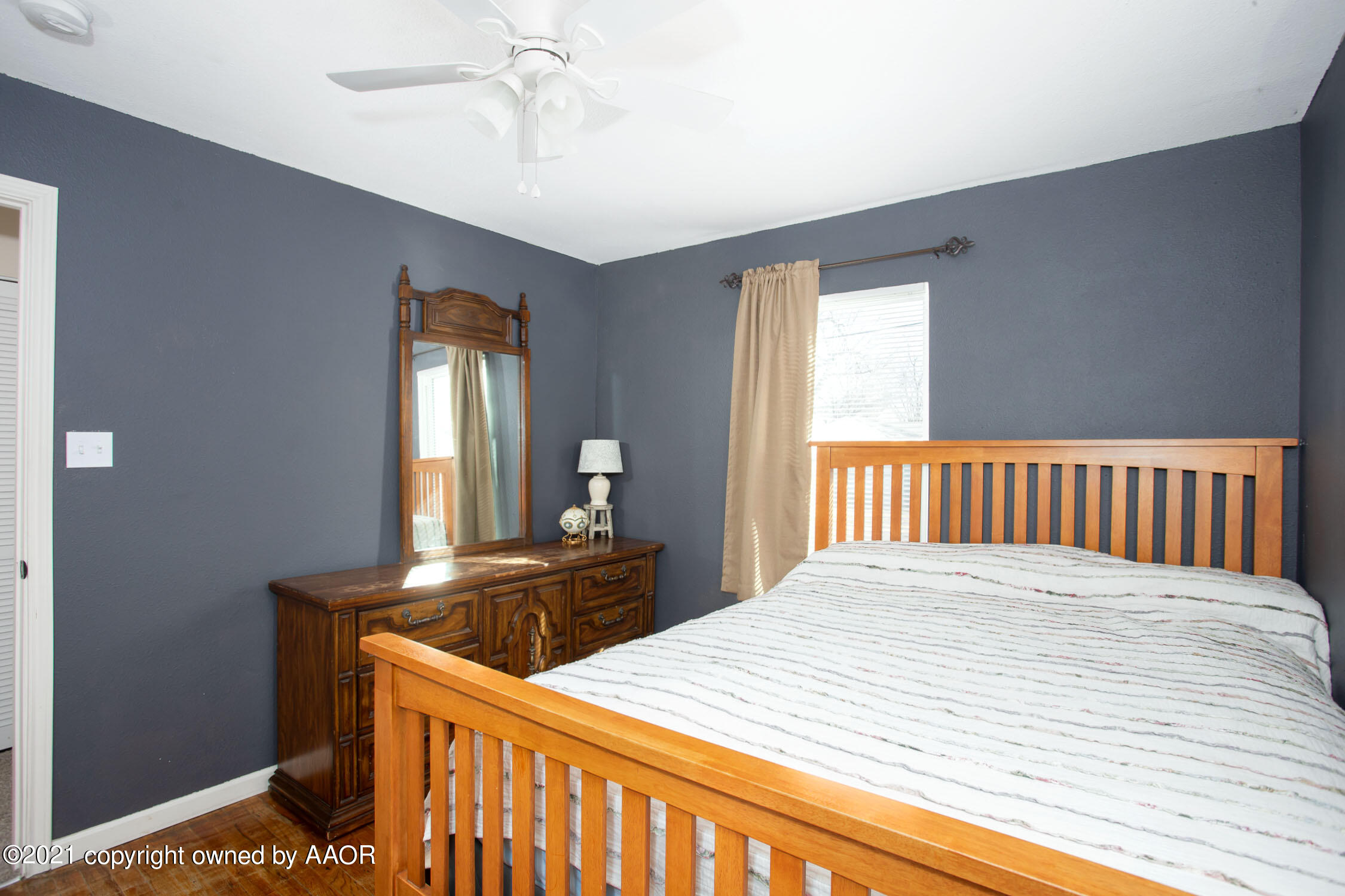 3807 South Jackson Street Amarillo, TX 79110 - Photo 10 of 17 a bedroom with a bed and window