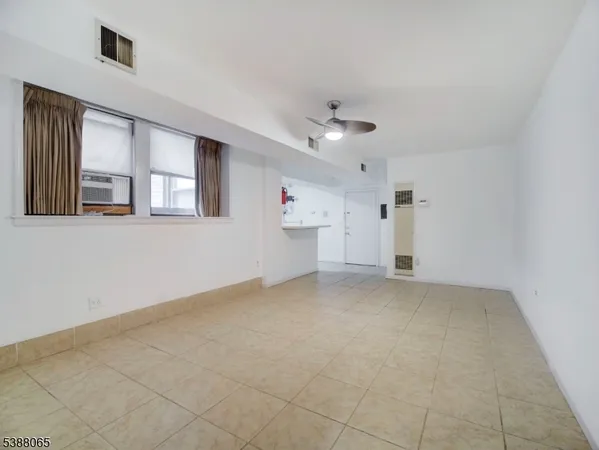 a view of empty room with windows