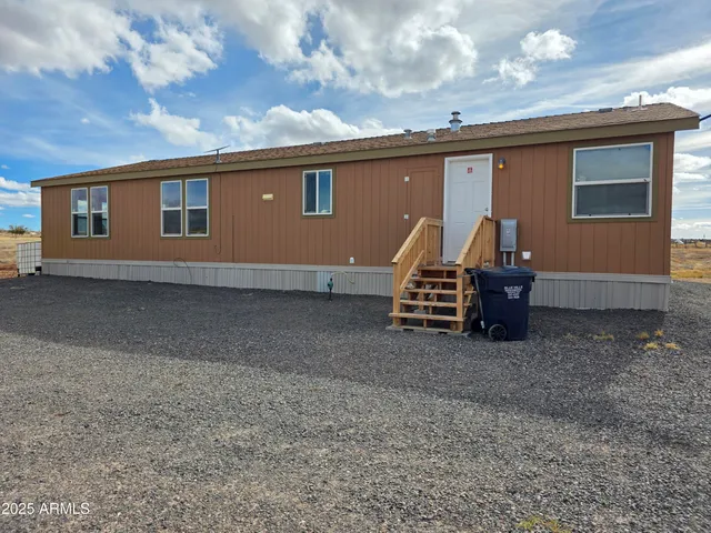 a view of backyard with deck