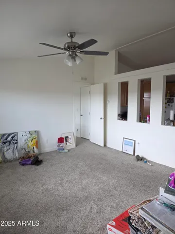 a bedroom with furniture and a window