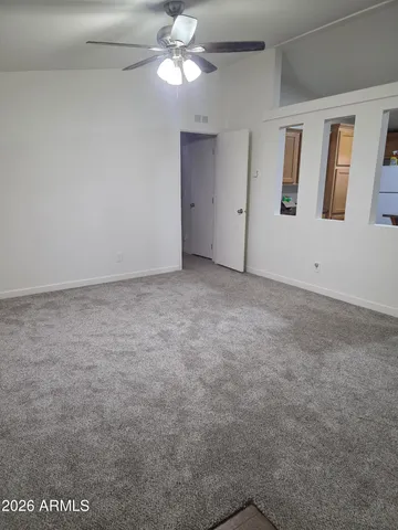 a view of an empty room with a window