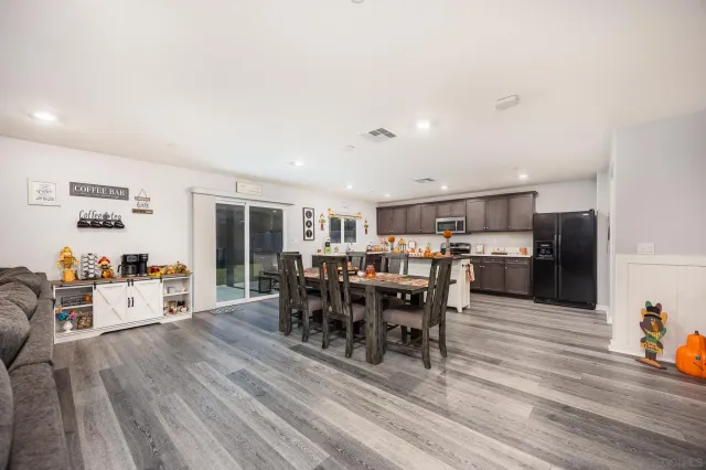 a view of a dining room with furniture wooden floor and chandelier