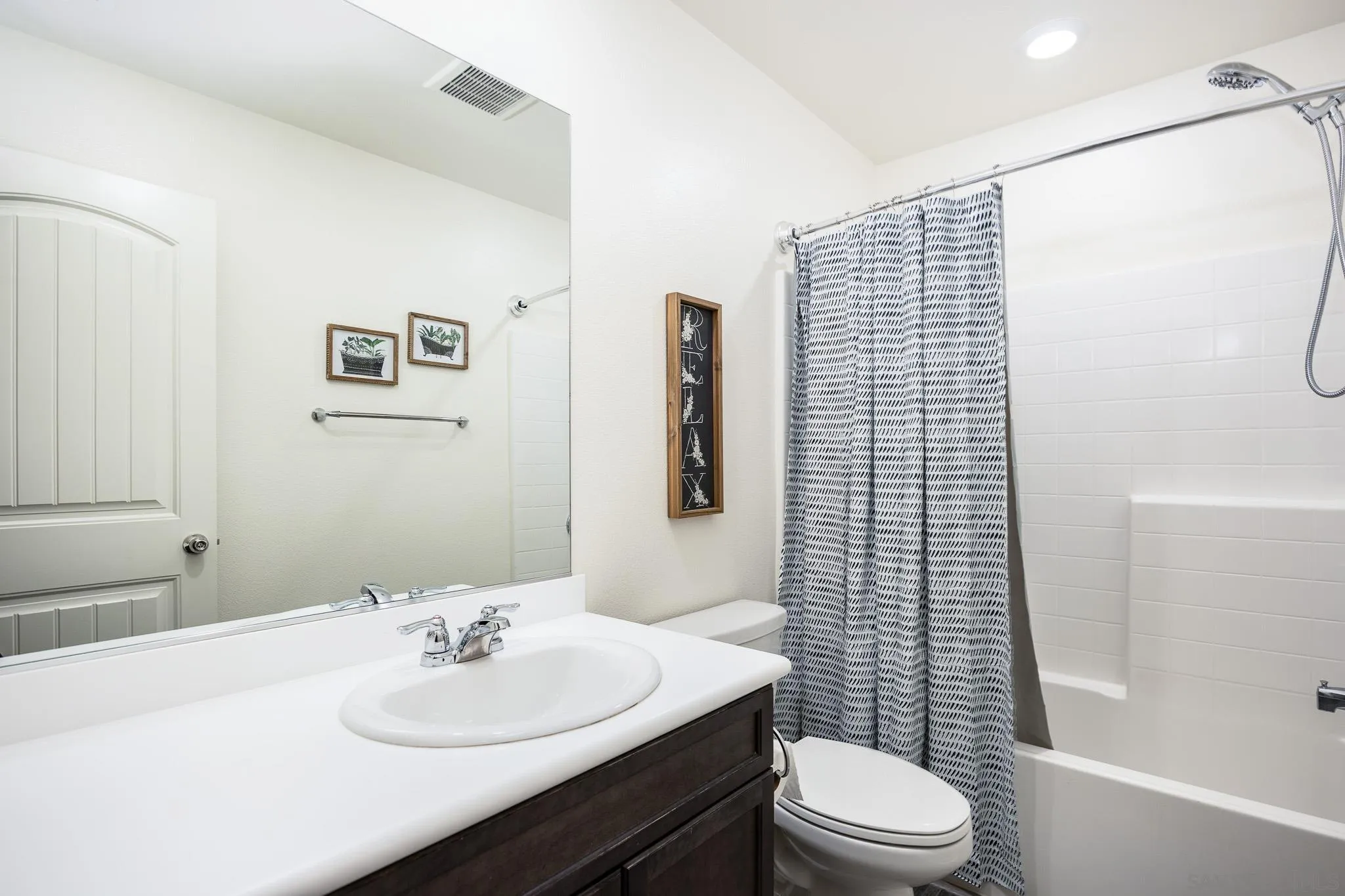 32089 Bunkhouse Road Winchester, CA 92596 - Photo 17 of 26 a bathroom with a sink a toilet and shower