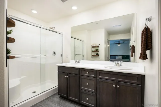 a bathroom with a double vanity sink mirror and double