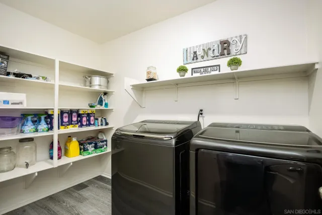 a utility room with washer and dryer