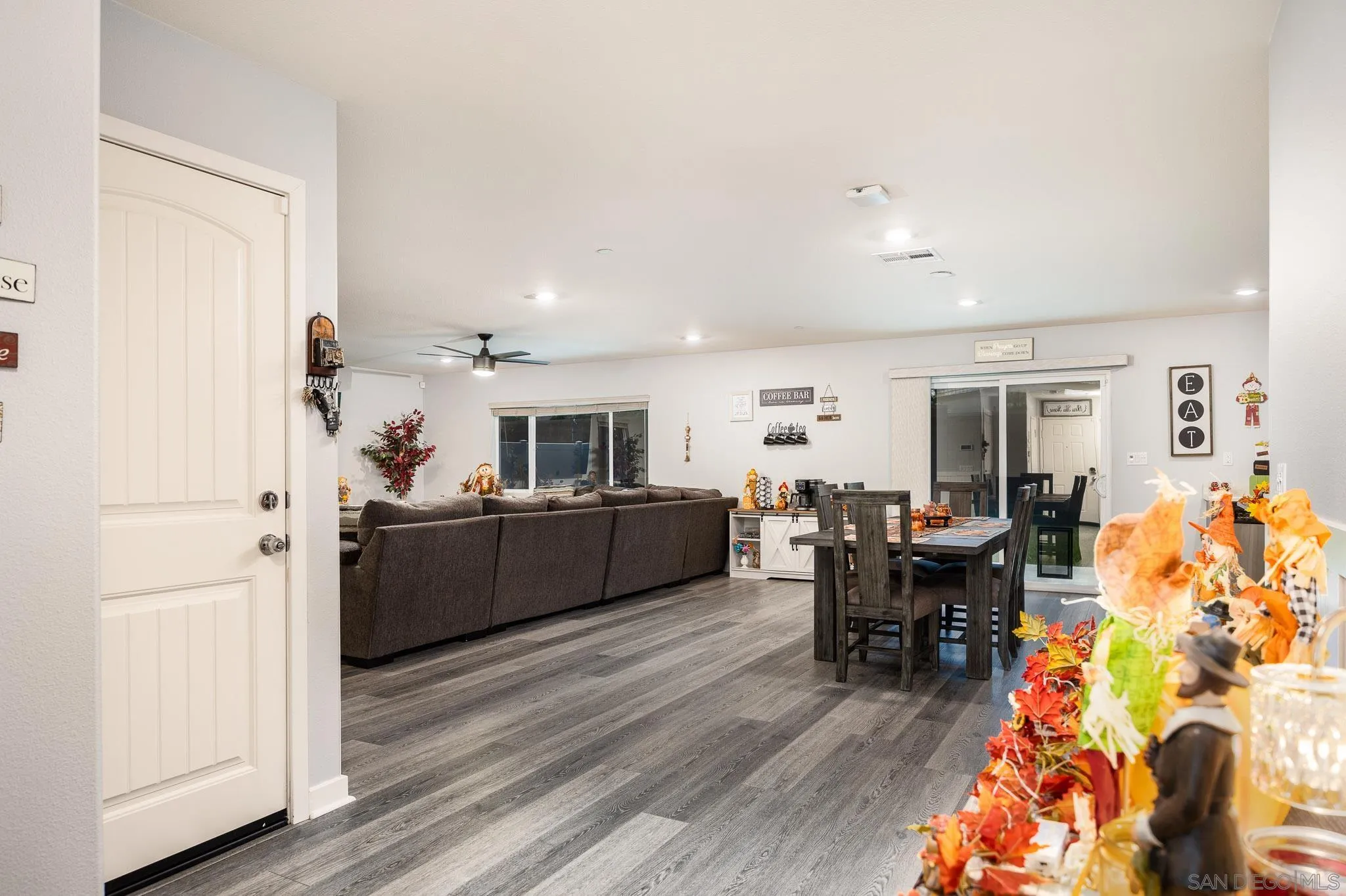 32089 Bunkhouse Road Winchester, CA 92596 - Photo 10 of 26 a kitchen with stainless steel appliances kitchen island granite countertop a refrigerator and a dining table