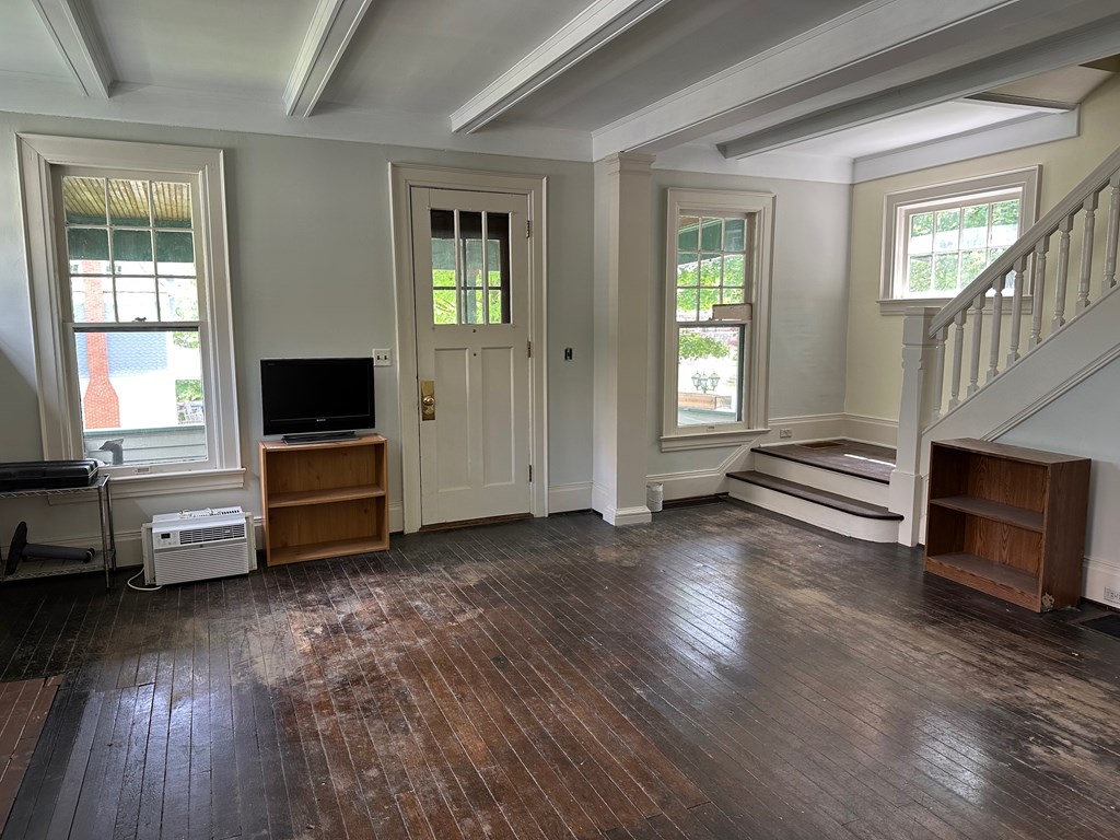 324 16th Street Franklin, PA 16323 - Photo 12 of 24 a view of livingroom with furniture wooden floor flat screen tv and windows