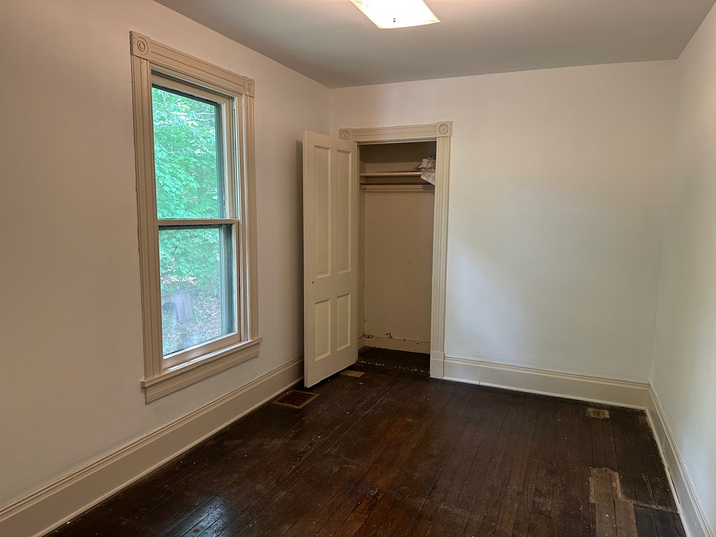 324 16th Street Franklin, PA 16323 - Photo 18 of 24 an empty room with wooden floor and windows