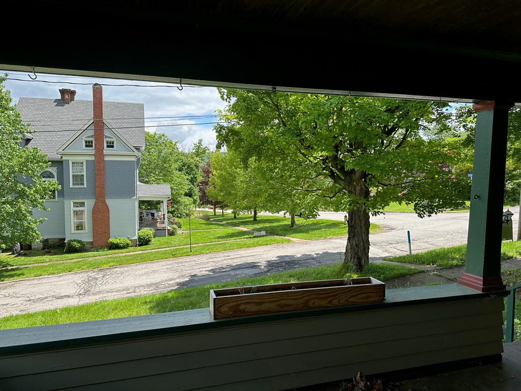 324 16th Street Franklin, PA 16323 - Photo 5 of 24 a view of a house with a yard and a tree