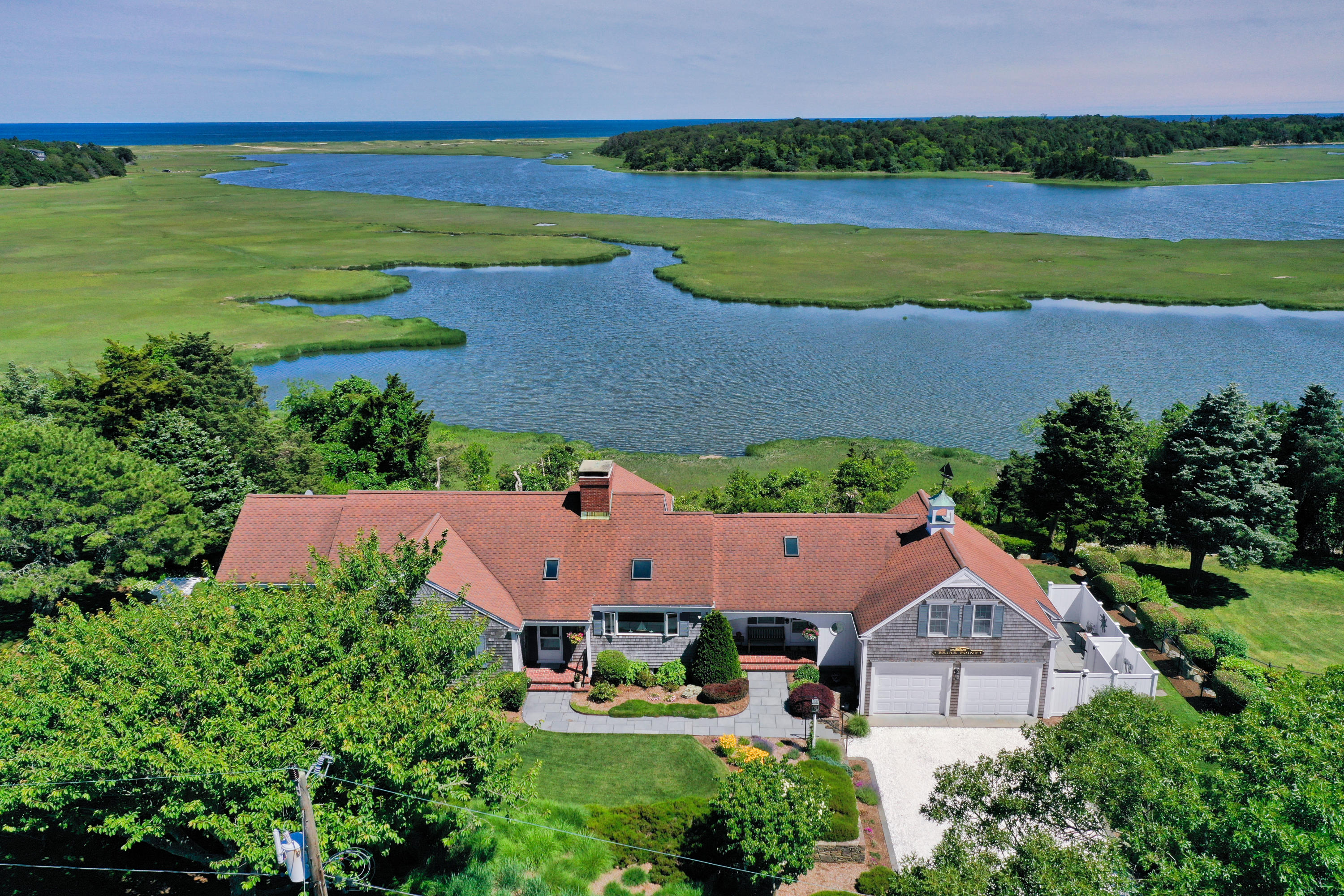 71 Briar Spring Road Orleans, MA 02653 - Photo 1 of 45 an aerial view of residential houses with outdoor space and lake view