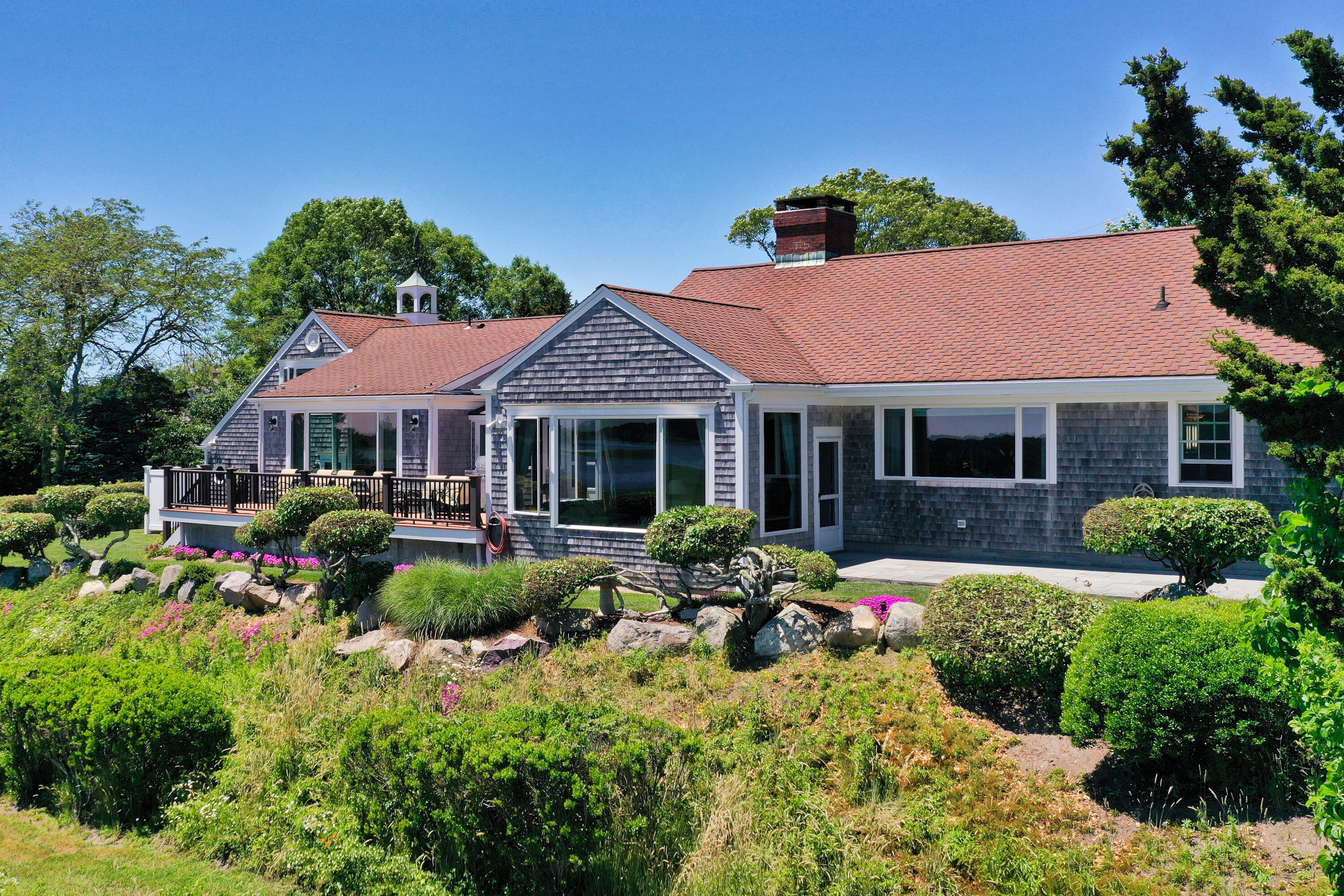 71 Briar Spring Road Orleans, MA 02653 - Photo 17 of 45 a view of a house with sitting area and garden