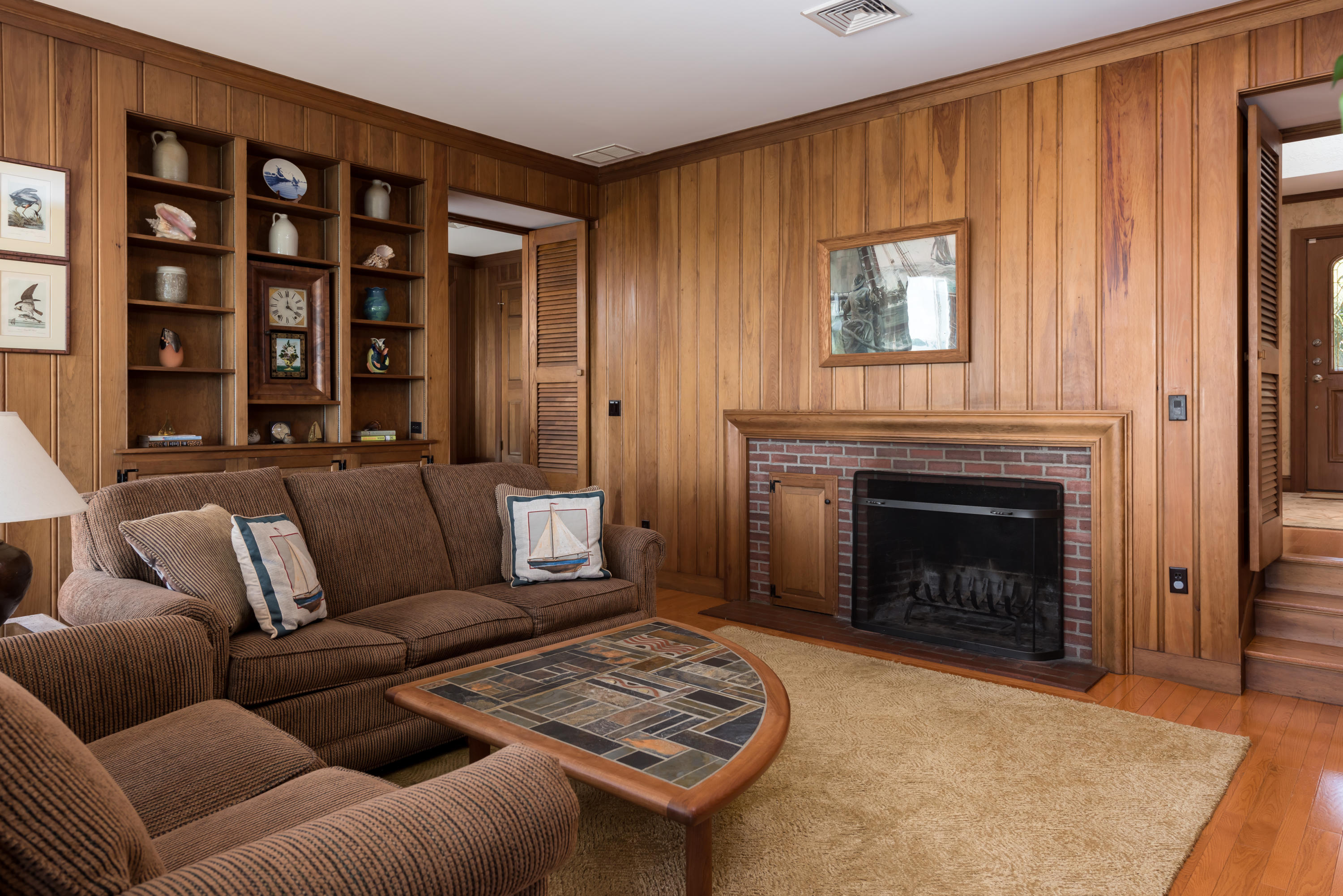 71 Briar Spring Road Orleans, MA 02653 - Photo 25 of 45 a living room with furniture and a fireplace