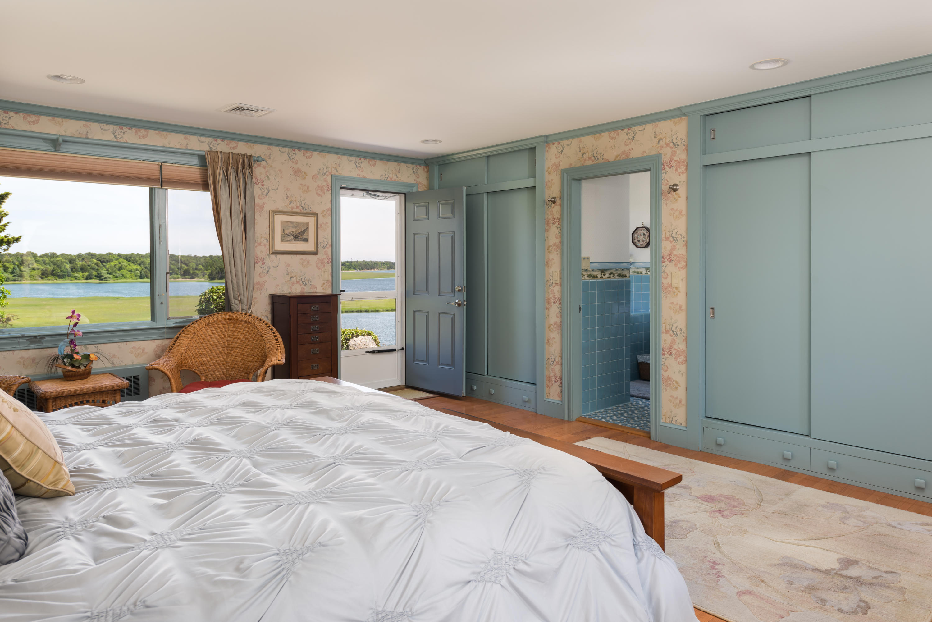 71 Briar Spring Road Orleans, MA 02653 - Photo 33 of 45 a bedroom with a bed and large windows