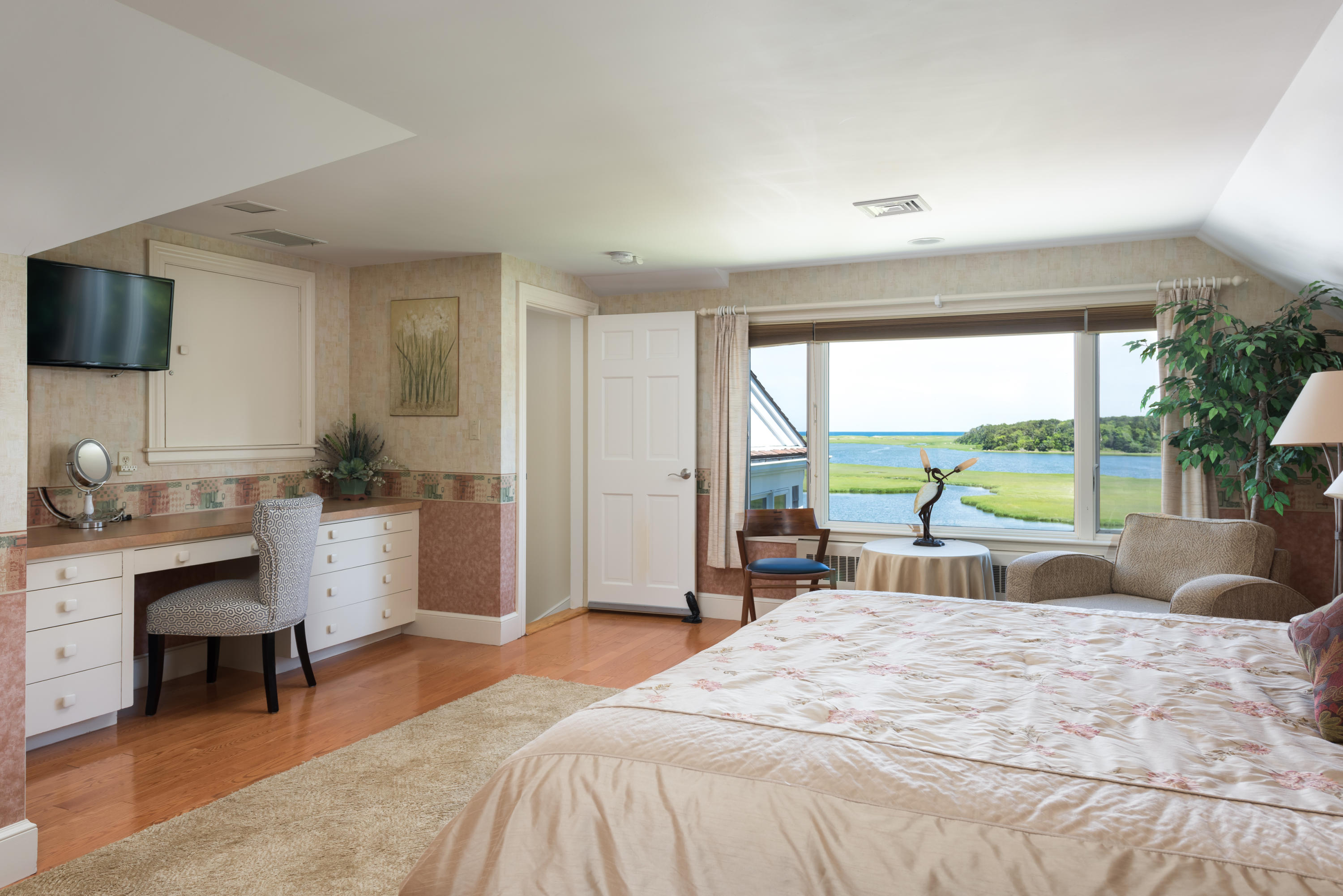 71 Briar Spring Road Orleans, MA 02653 - Photo 40 of 45 a bedroom with a bed and a large window