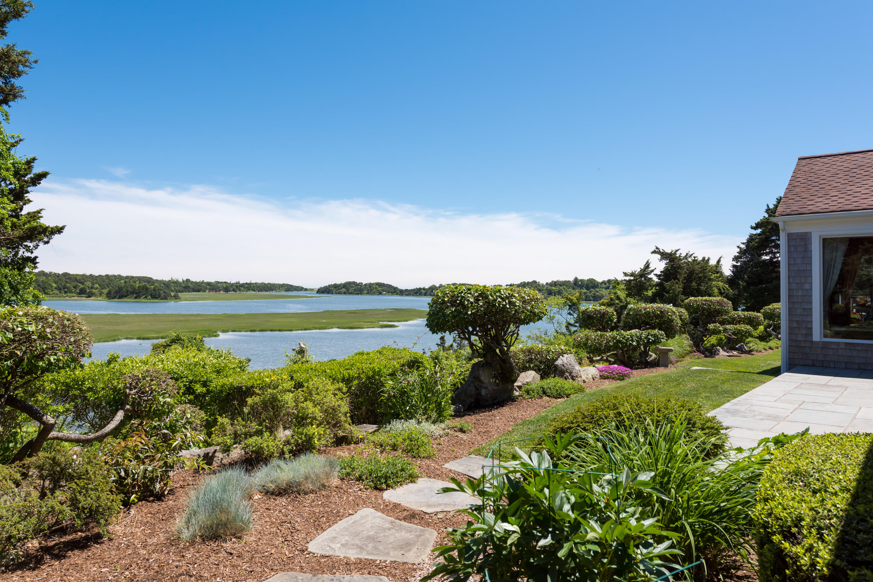71 Briar Spring Road Orleans, MA 02653 - Photo 5 of 45 a view of a lake with a building in front of it