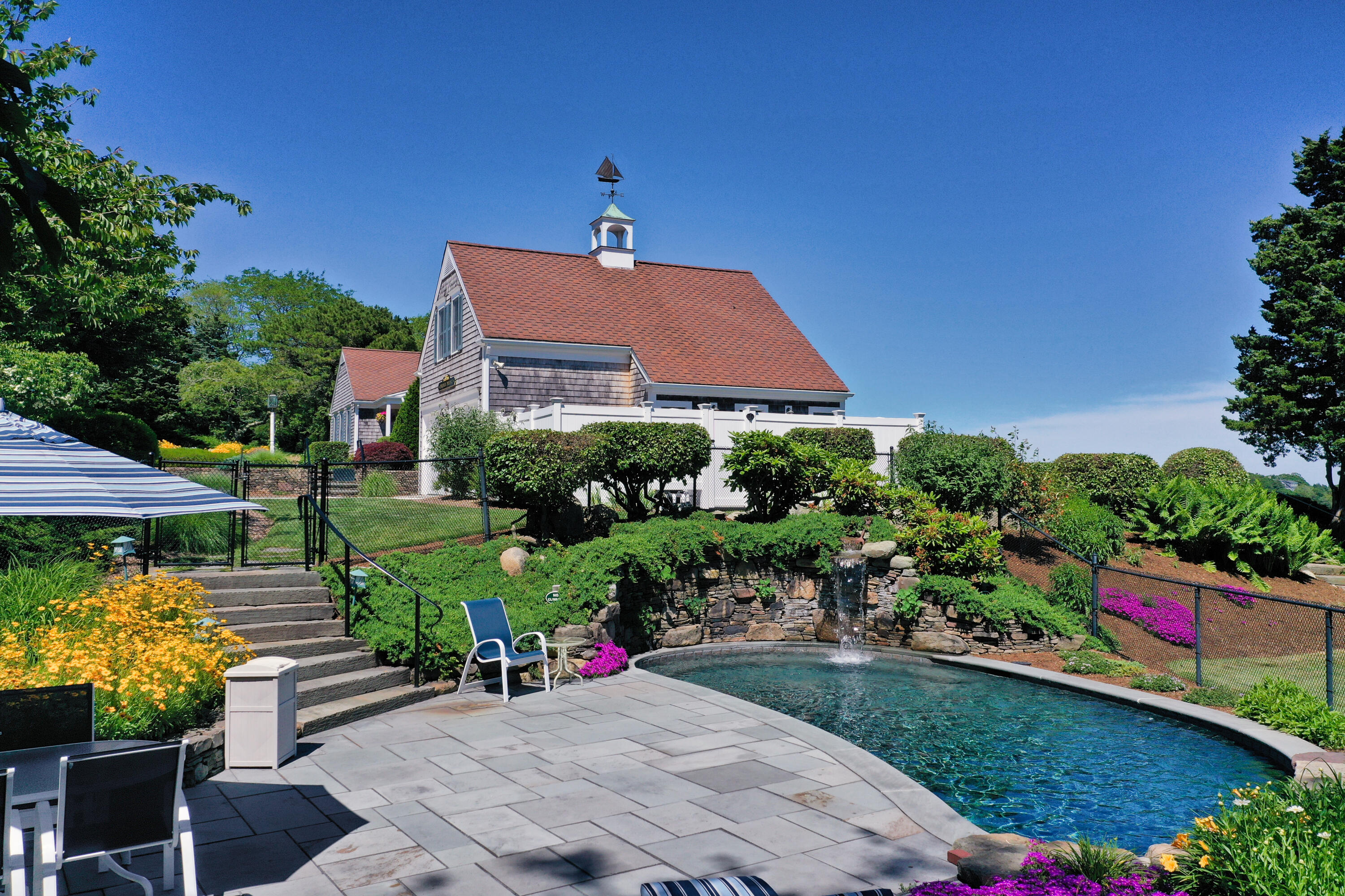 71 Briar Spring Road Orleans, MA 02653 - Photo 8 of 45 a view of a house with a yard and garden