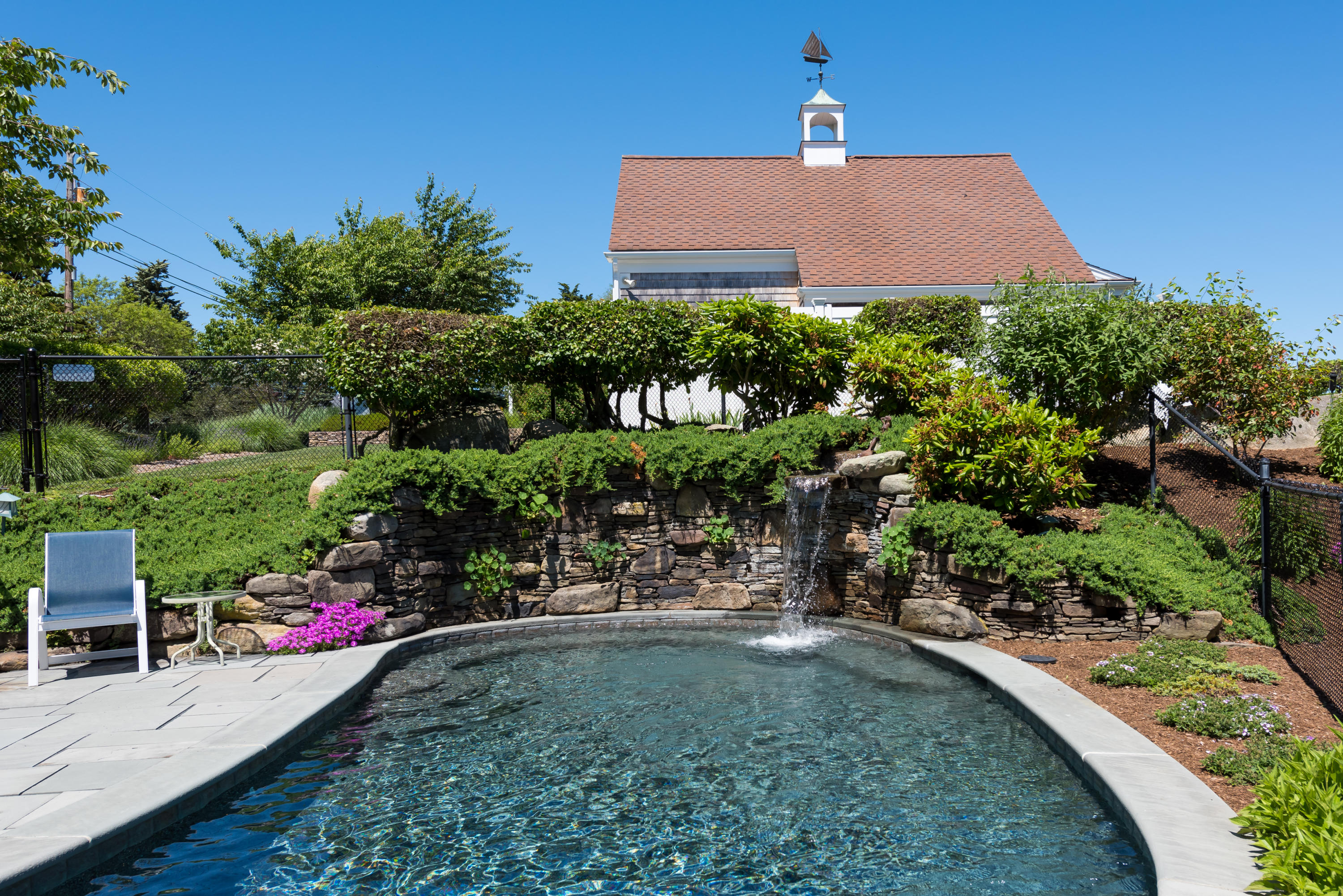 71 Briar Spring Road Orleans, MA 02653 - Photo 10 of 45 a front view of a house with a yard