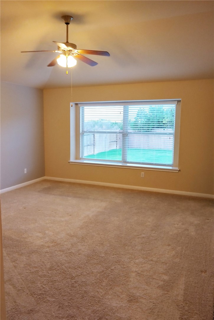 348 Stone View Trail Austin, TX 78737 - Photo 10 of 26 Master bedroom has a window seat and large window with view of the back yard