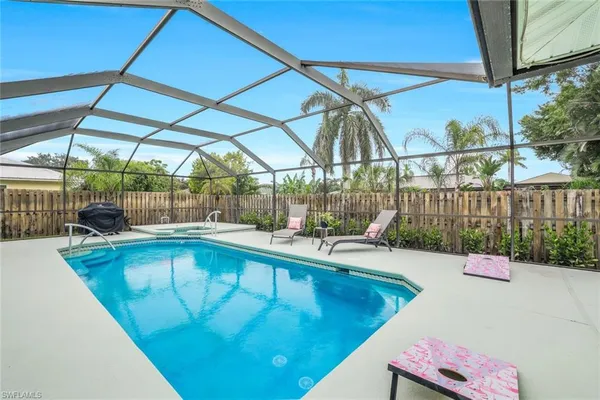 a view of a swimming pool with a patio