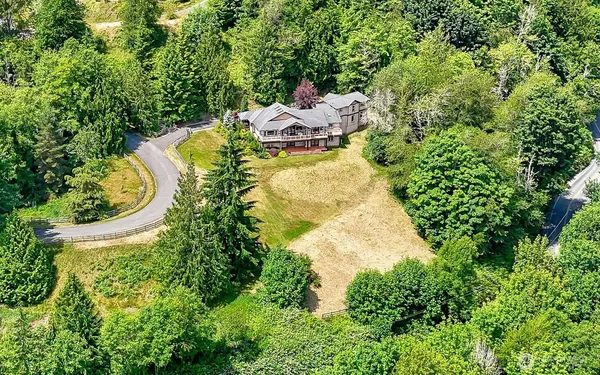 a aerial view of a house with a yard and garden