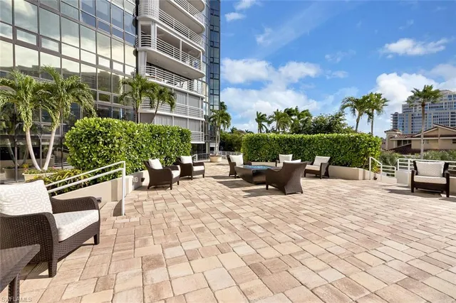 a view of a patio with couches and potted plants