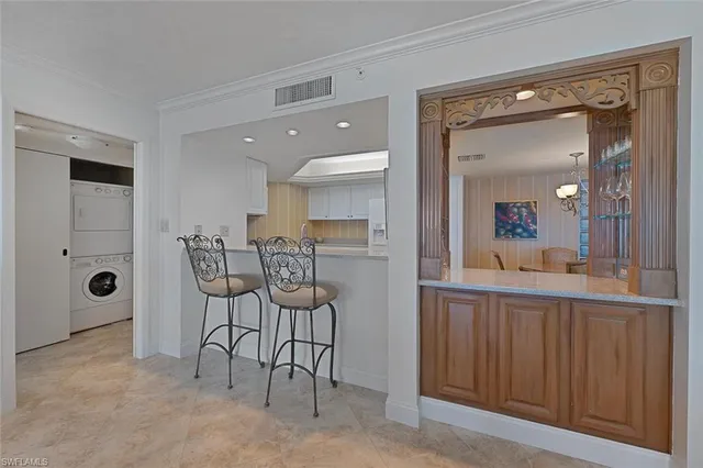 a view of a room with furniture and a mirror