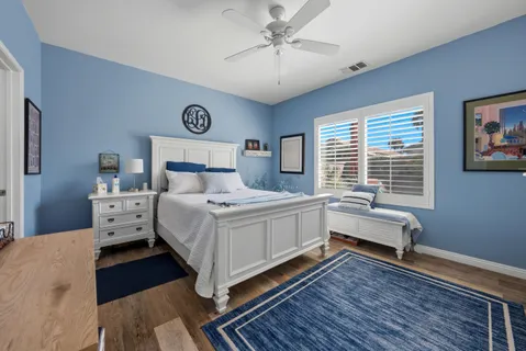 a bed room with a bed and a window