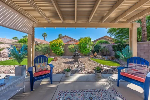 a view of a backyard with sitting area