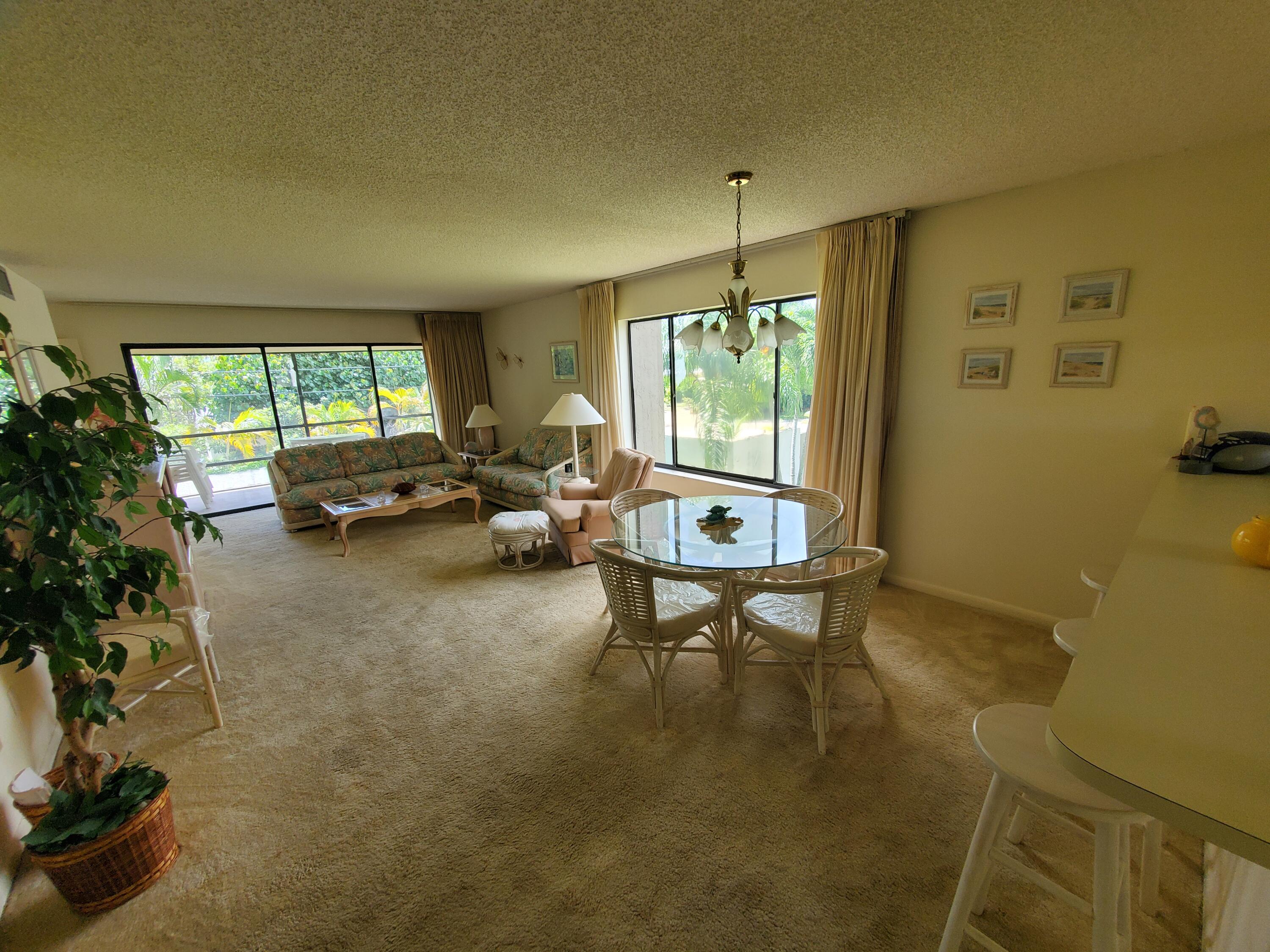 1600 Northeast Dixie Highway, Unit 9206 Jensen Beach, FL 34957 - Photo 11 of 33 Livingroom Dining Room Side Window