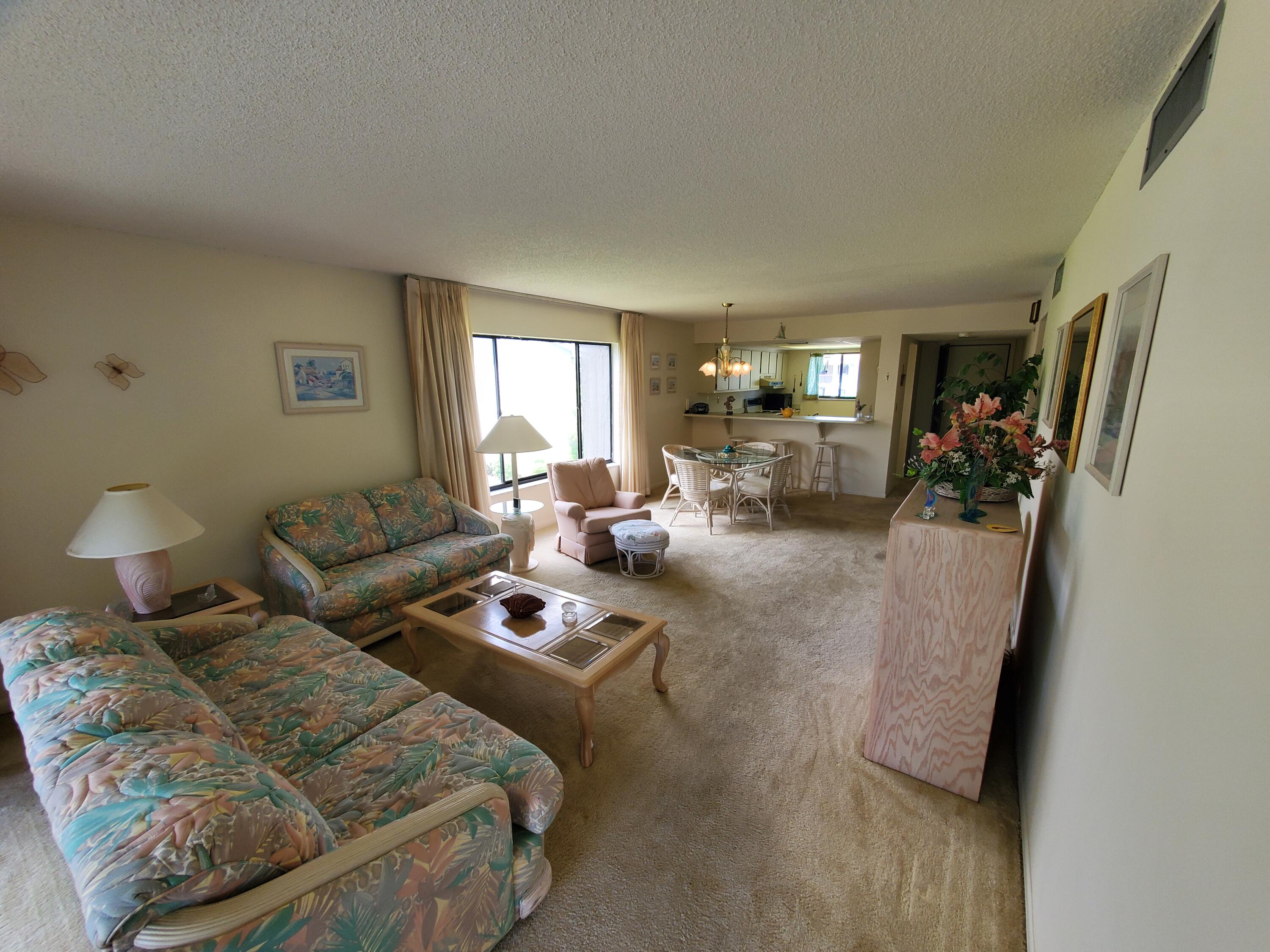 1600 Northeast Dixie Highway, Unit 9206 Jensen Beach, FL 34957 - Photo 13 of 33 Living Room towards Kitchen