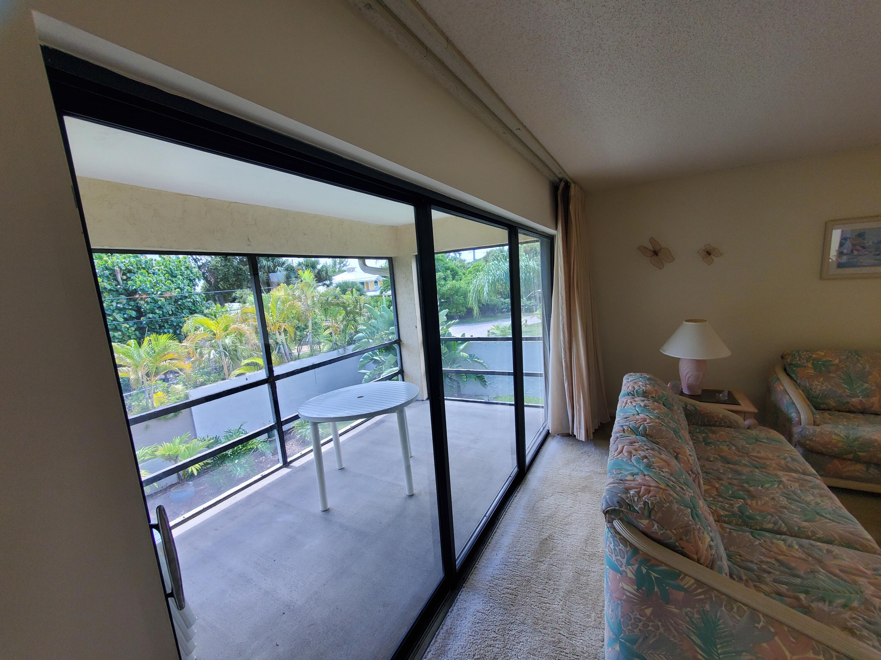 1600 Northeast Dixie Highway, Unit 9206 Jensen Beach, FL 34957 - Photo 14 of 33 Private Screened Porch