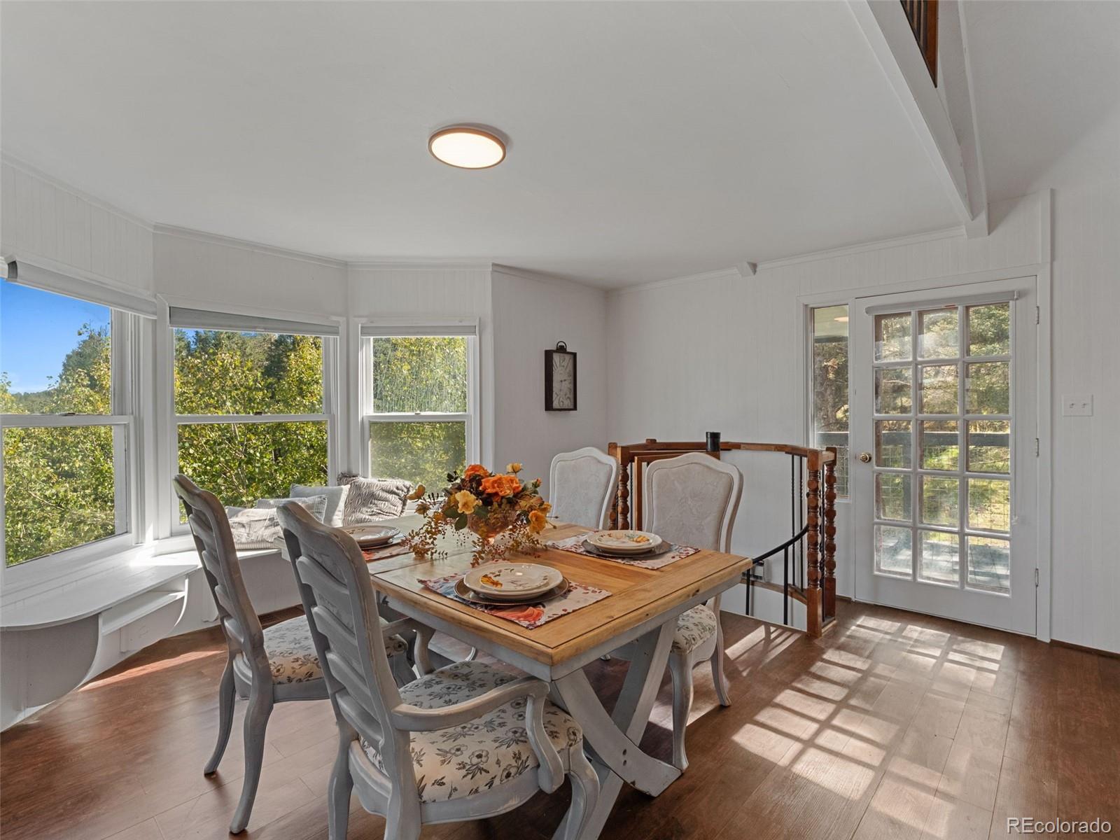 11825 South Little Turtle Lane Conifer, CO 80433 - Photo 16 of 34 a view of a dining room with furniture window and outside view