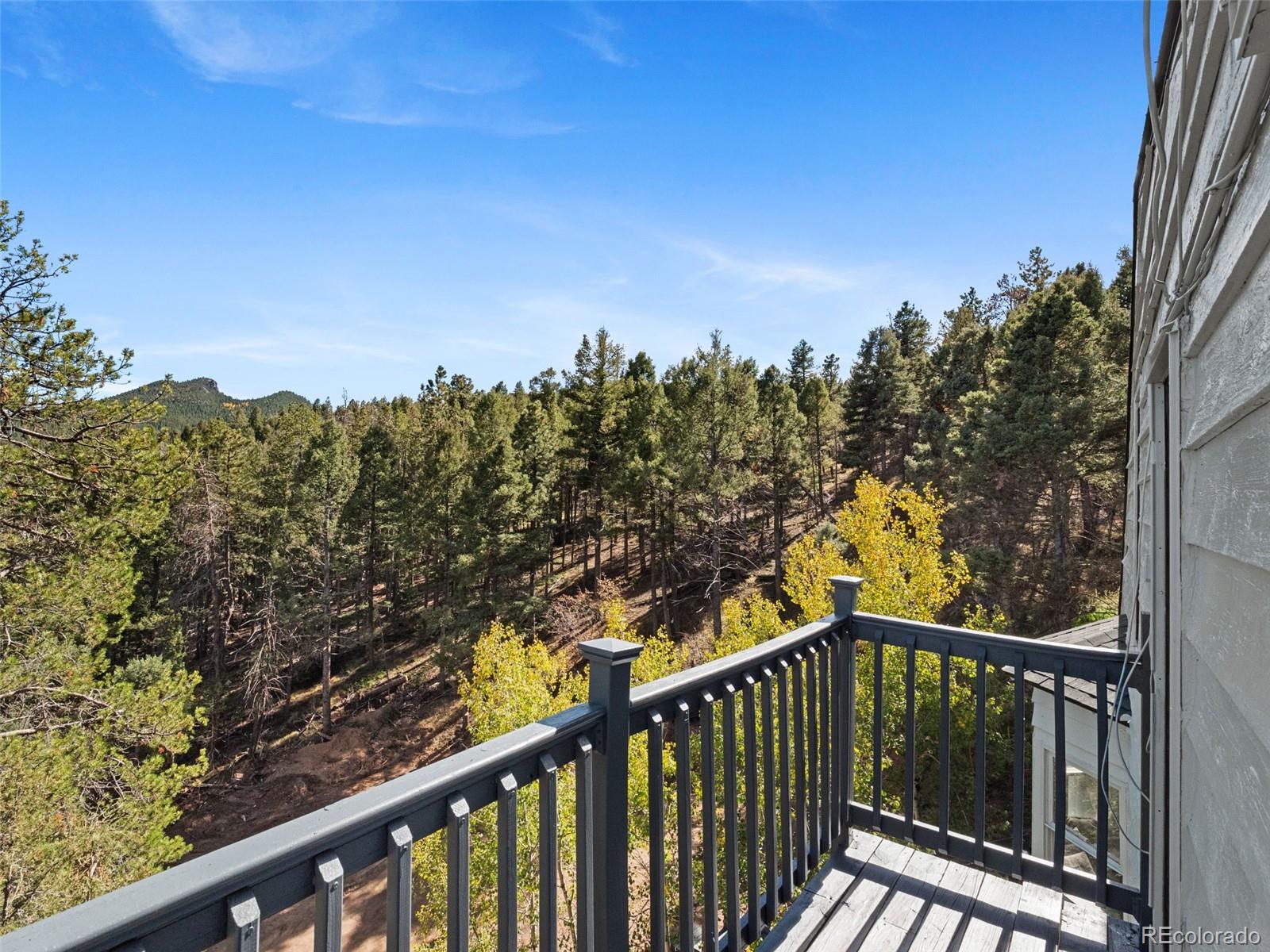 11825 South Little Turtle Lane Conifer, CO 80433 - Photo 10 of 34 a view of a balcony with wooden fence