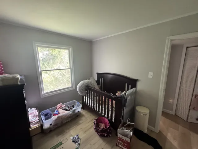 a bedroom with a bed and a closet