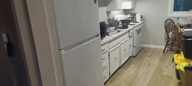 a bedroom with a bed and a desk