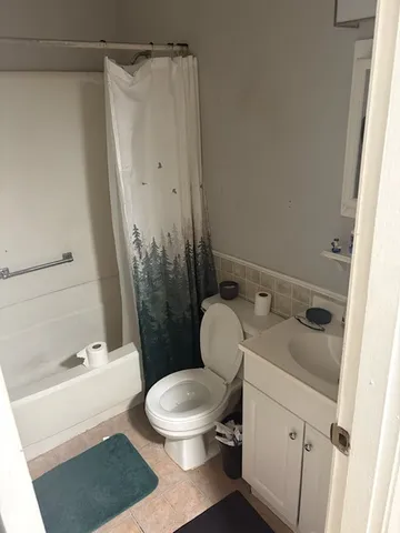 a kitchen with stainless steel appliances a refrigerator sink and cabinets