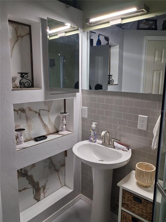 10360 County Road 18 Lake Butler, FL 32054 - Photo 16 of 43 a bathroom with a sink and a mirror