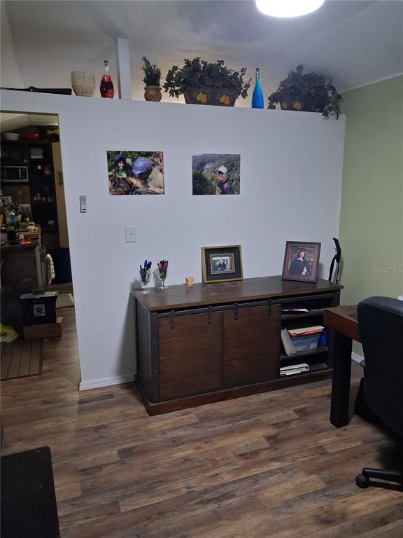 10360 County Road 18 Lake Butler, FL 32054 - Photo 17 of 43 a view of a workspace with furniture and wooden floor