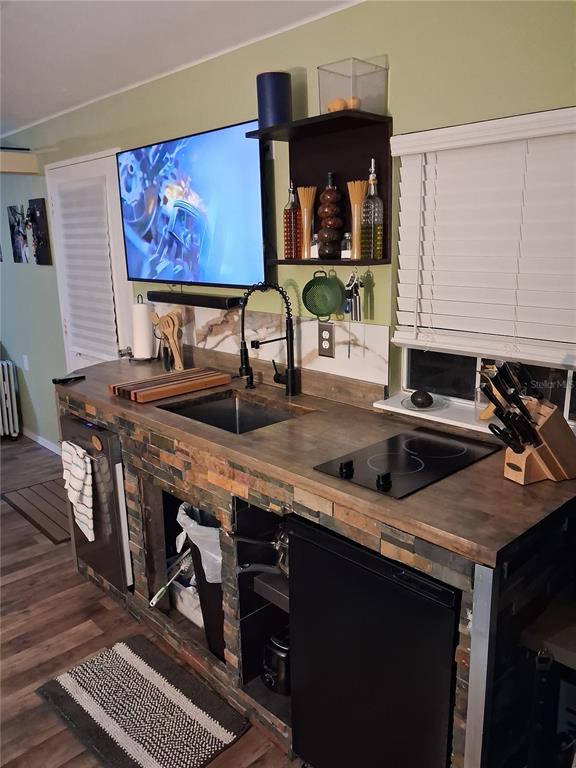 10360 County Road 18 Lake Butler, FL 32054 - Photo 25 of 43 a kitchen with stainless steel appliances a sink a stove and a refrigerator