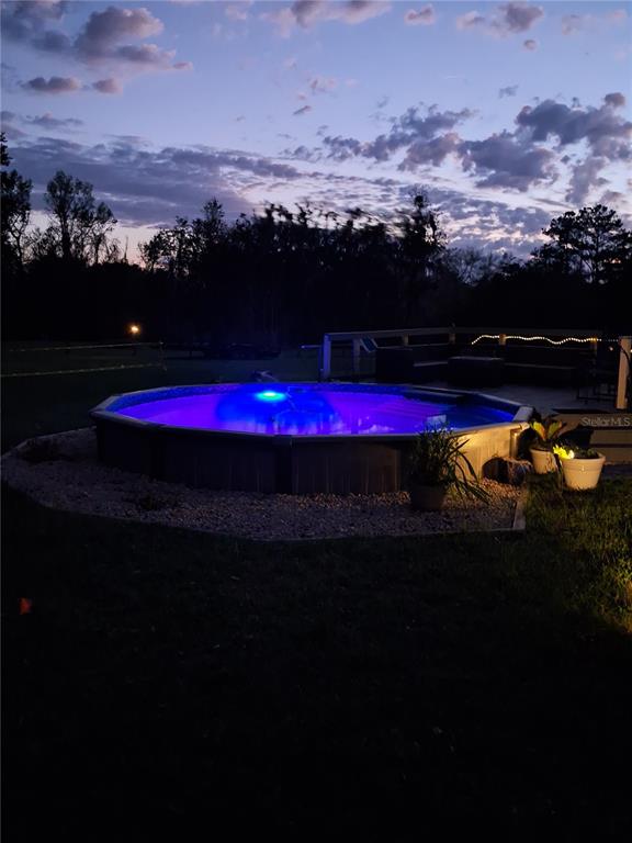 10360 County Road 18 Lake Butler, FL 32054 - Photo 29 of 43 a view of swimming pool with a table and chairs