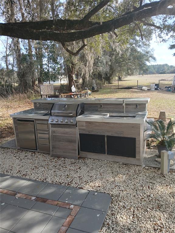 10360 County Road 18 Lake Butler, FL 32054 - Photo 32 of 43 a open kitchen with a sink and a yard