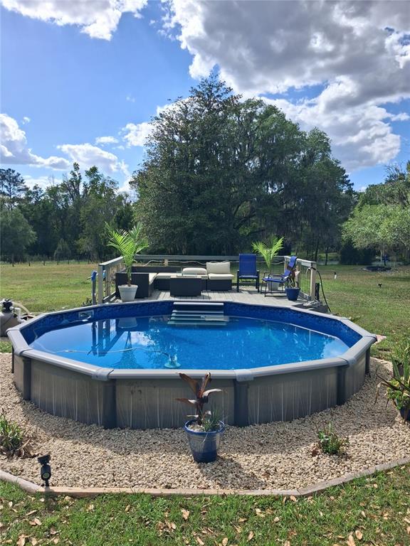 10360 County Road 18 Lake Butler, FL 32054 - Photo 35 of 43 a view of a swimming pool with a yard
